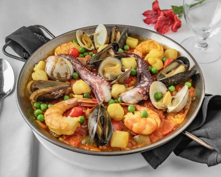 A paellera of seafood paella with mussels and clams