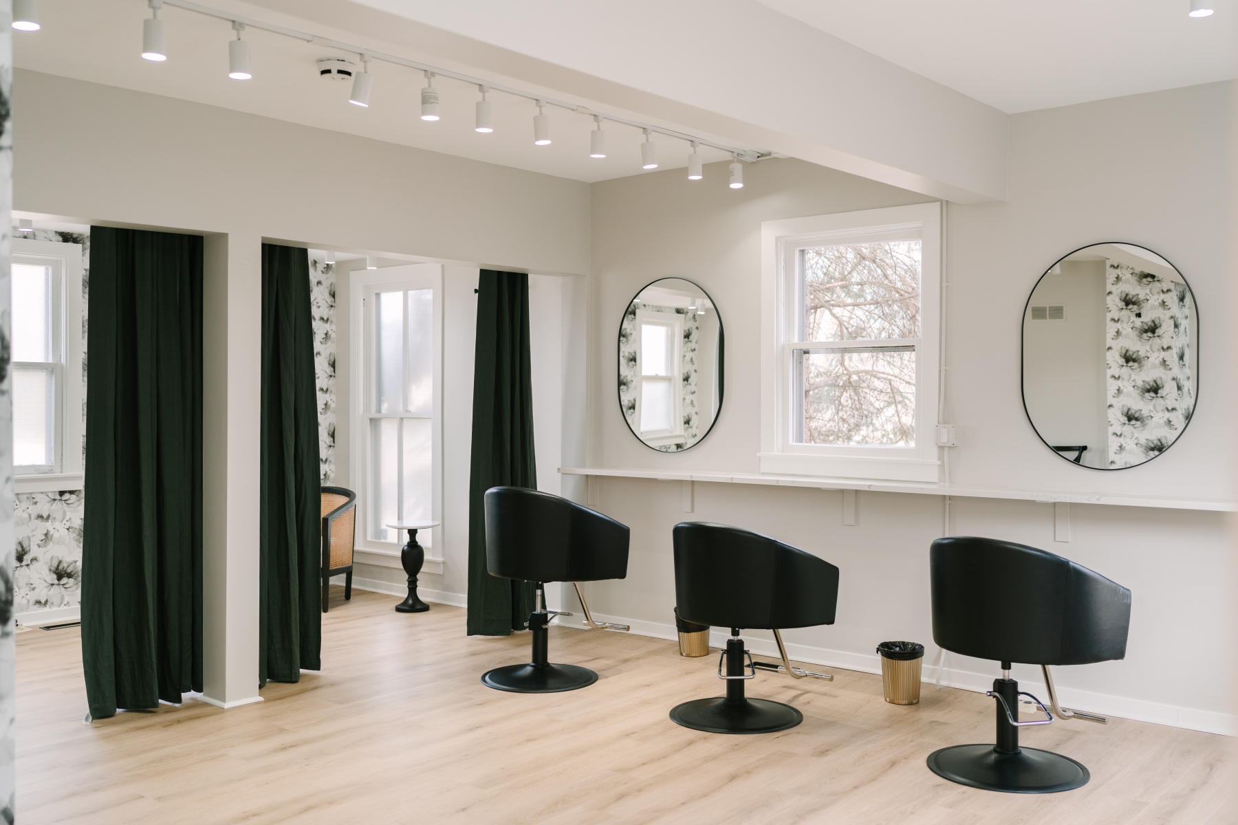 The getting-ready suite with mirrors and styling chairs