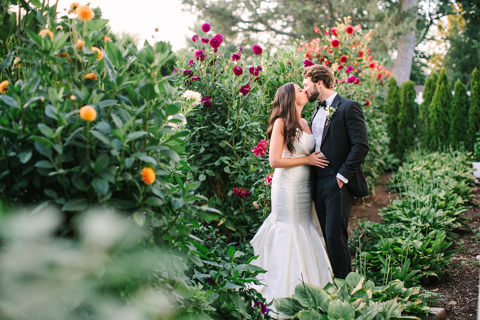 A couple among the estate borders at golden hour