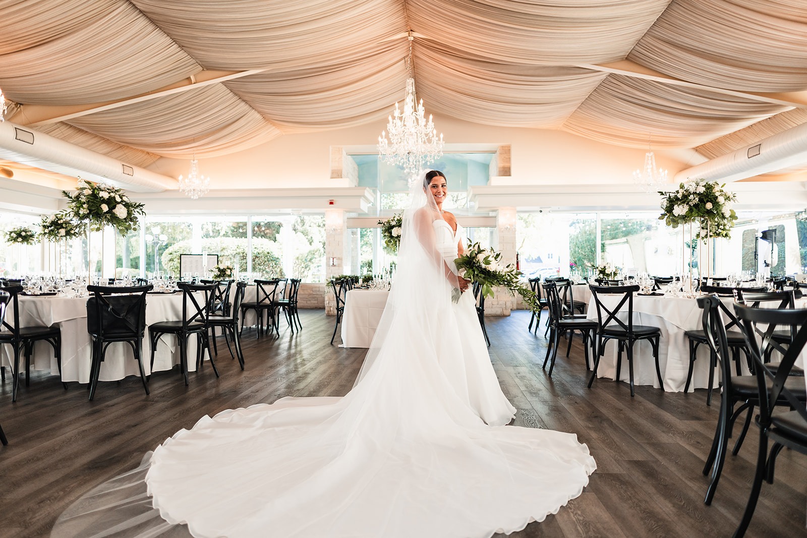 A bride in the Pavilion, her train swept across the floor