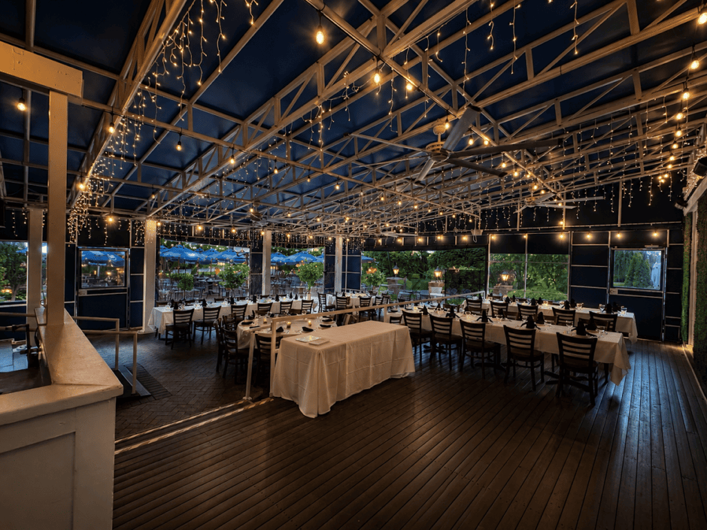 The covered Veranda, strung with lights and open to the gardens