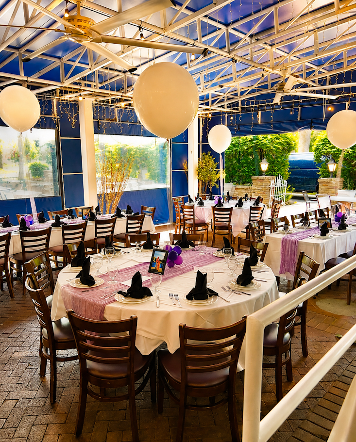 A tented veranda decorated with balloons for a party
